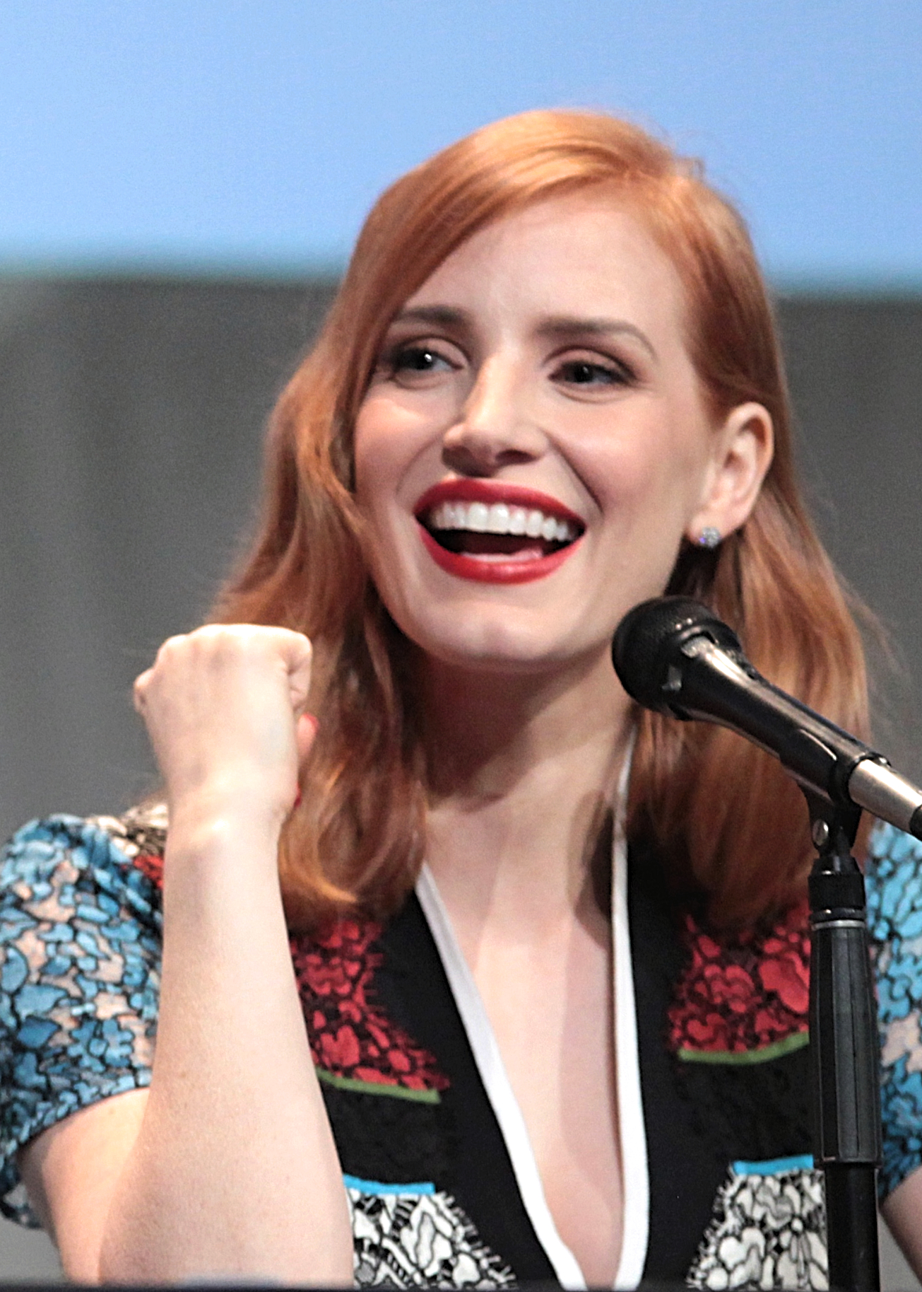 a head shot of chastain as she laughs away from the camera