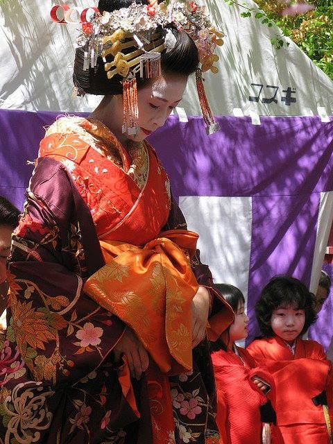 a woman dressed as a tayuu along with two kamuro japanese geishajapanese