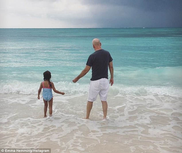action dad bruce took charge as he enjoyed a beach day with his young daughter