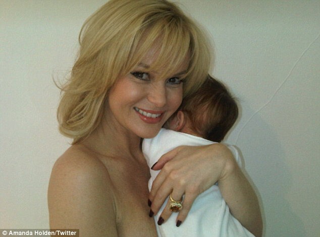 amanda holden shows some skin as she cuddles up to baby hollie