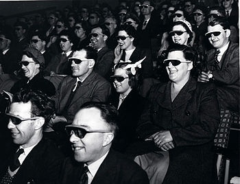 audience wearing special glasses watch a 1