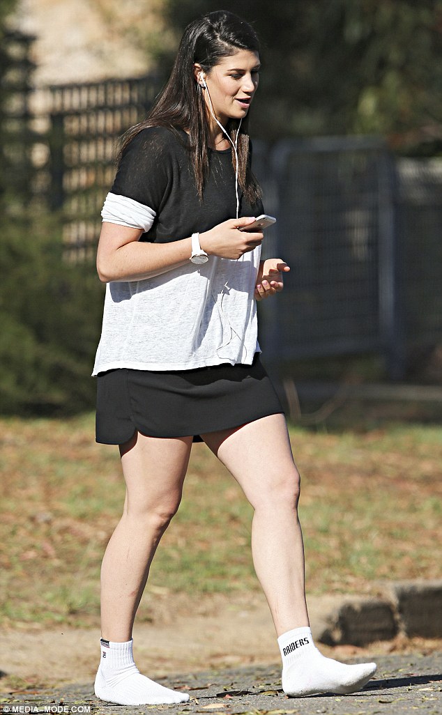 black and white stephanie rice was roadside on thursday wearing white mismatched socks as she
