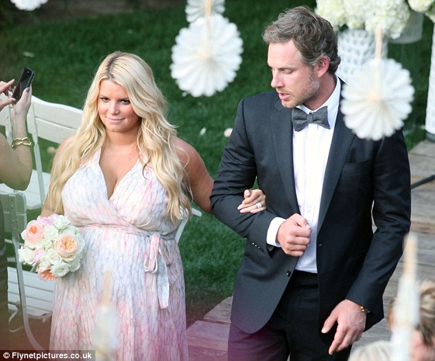 bumping along jessica simpson whose baby is due any day waddled down