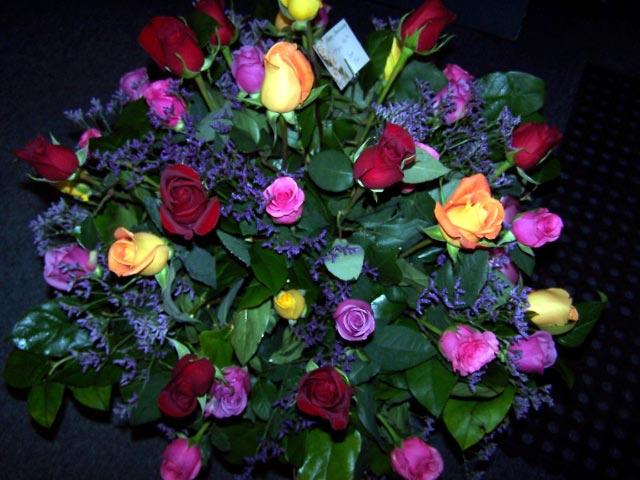 c multi colored roses vased