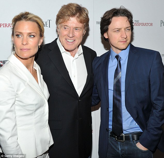 celebration robin also huddled with the films director robert redford and male co star