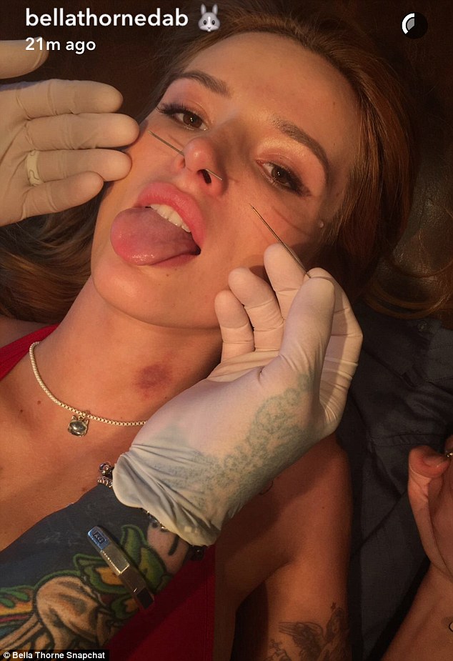 clearly visible bella was showing off her own hickey while getting her septum pierced last