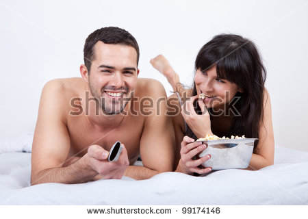 couple lying laptop bed watching porn stock photo 2