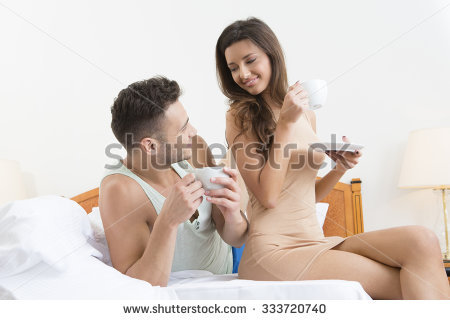 couple lying laptop bed watching porn stock photo