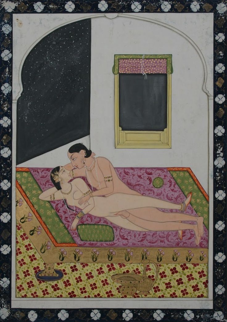 couple making love in erotic asana sex position on a palace terrace at night