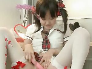 cute asian schoolgirl joyfully vibrates her pussy 1