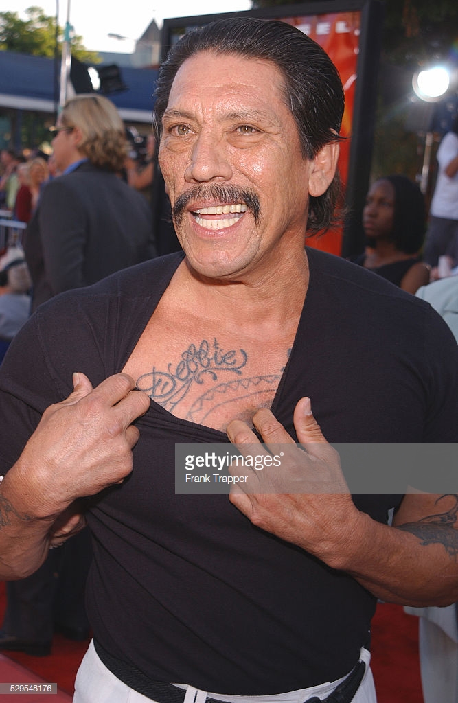 danny trejo shows off his tattoos while arriving at the world of picture