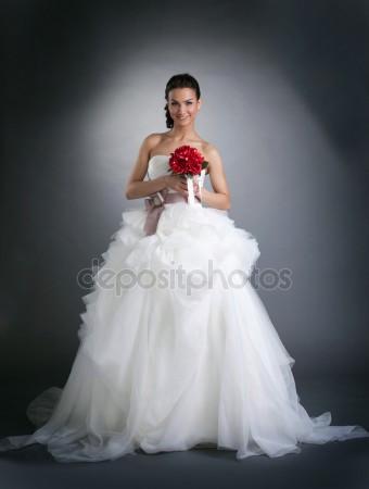depositphotos young smiling woman posing in wedding dress