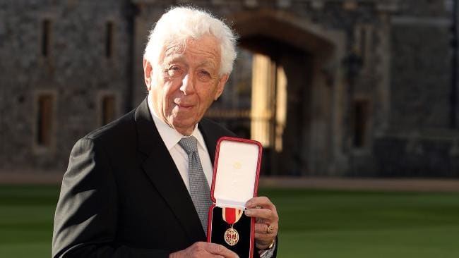 frank lowy poses with his medal after being created a knights bachelor knighthood