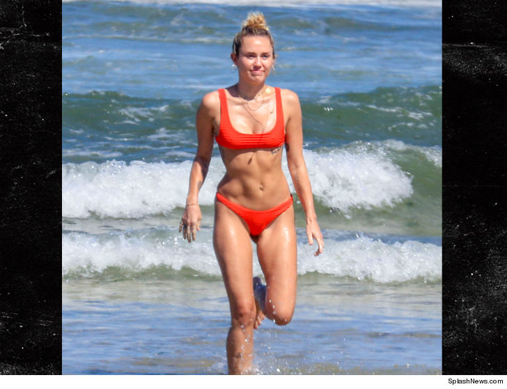 januarys not even over but miley cyrus is showing off her best summer beach bod already