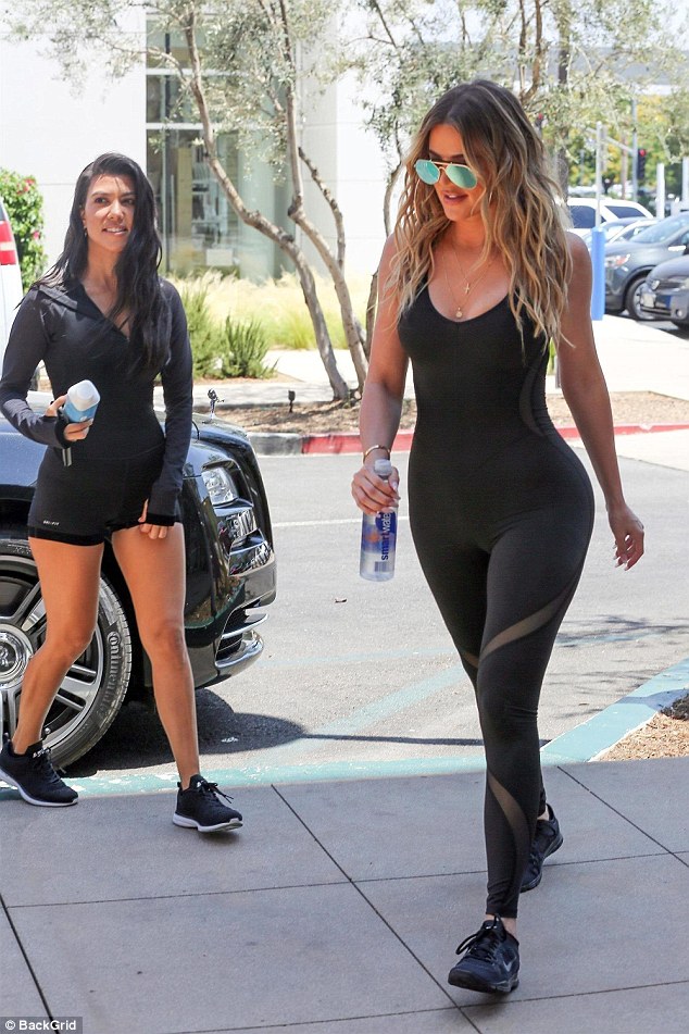 khloe and kourtney kardashian show off their curves daily mail