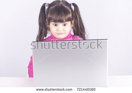little girl reacts with shock after accidentally watching inappropriate content while surfing the internet