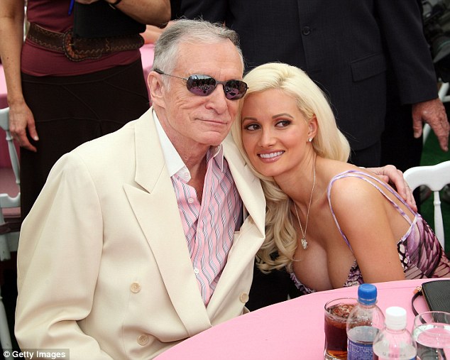 living it up holly madison looked happy when she was pictured with hugh hefner