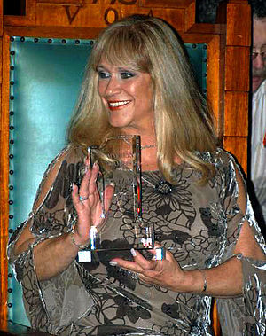 marilyn chambers holding her lifetime achievement foxe award