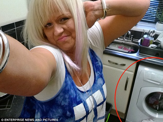 miss hinte is pictured here posing in front of her washing machine circled in red