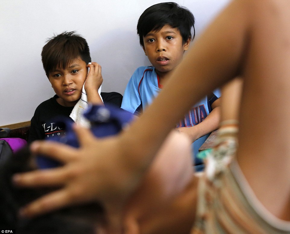 philippines boys undergo mass circumcision on school tables