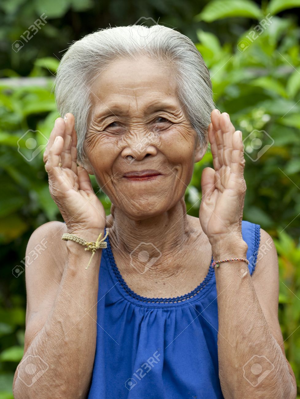 portrait old asian woman with gestures stock photo