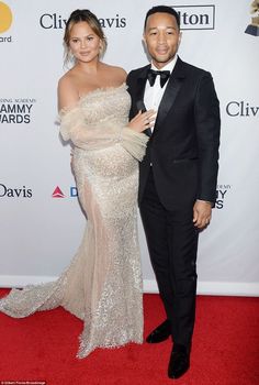 pregnant chrissy poses with john at clive davis pre grammy bash