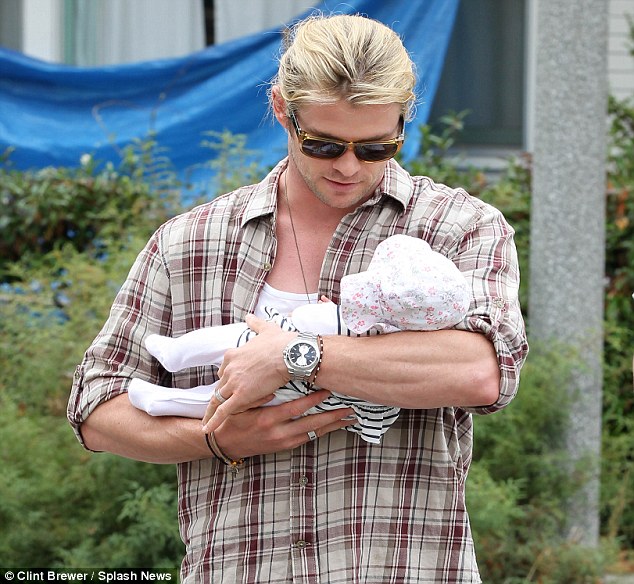 rock steady chris hemsworth cradled his new daughter india on an outing in santa monica