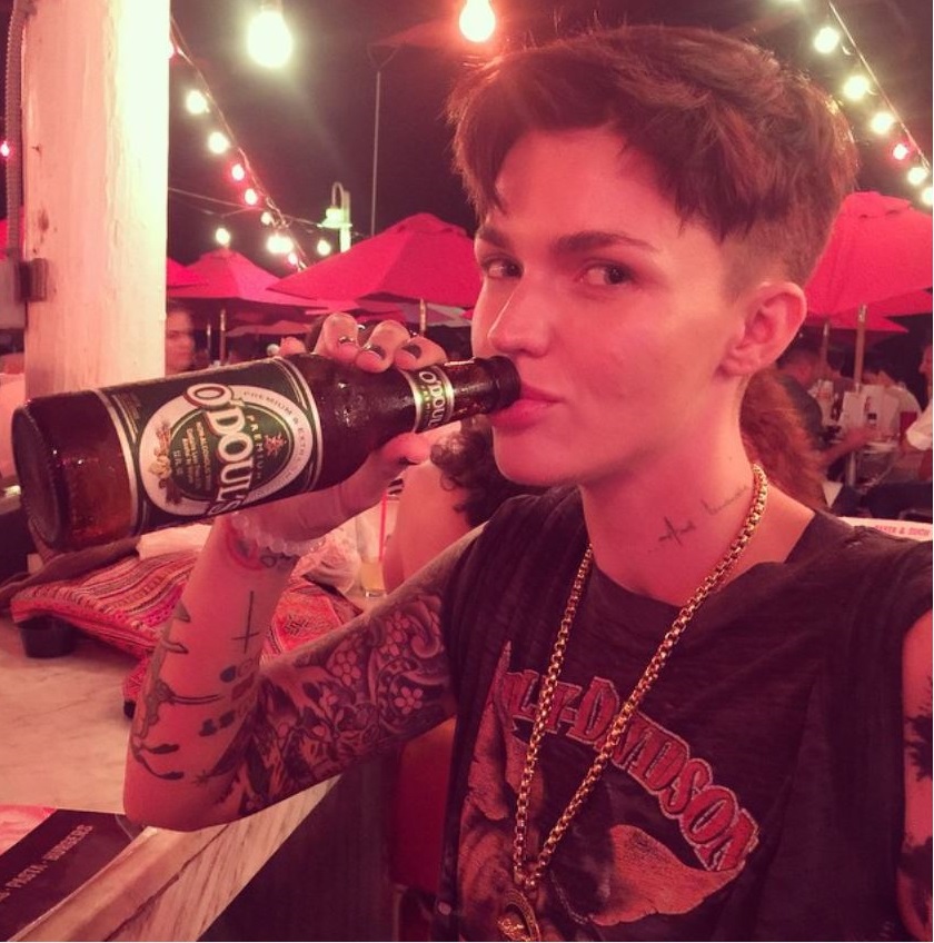 ruby rose drinking a beer under the red lights image instagram photo of lesbian actress orange is the new black star