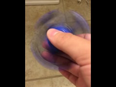 spinning a fidget spinner while i take a fat fucking shit
