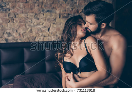 stock photo beautiful half naked brunet young couple is embracing in the bed room about to have sex so tender