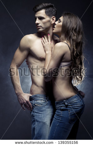 stock photo beautiful young smiling couple in love embracing indoor