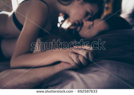stock photo close up cropped photo of beautiful half naked brunet young couple embracing and kissing in bed