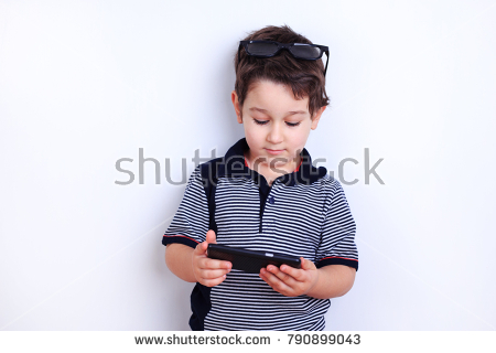 stock photo cute boy with smartphone child surfing internet or watching video on mobile phone technology 1