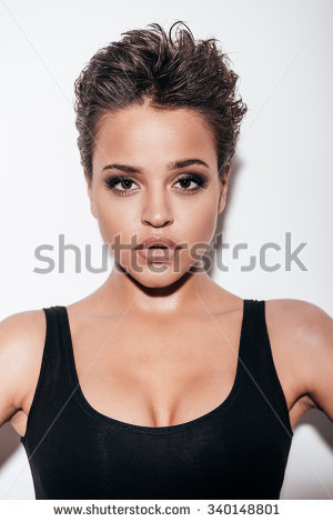 stock photo gorgeous beauty beautiful young short hair woman in black tank top looking at camera while