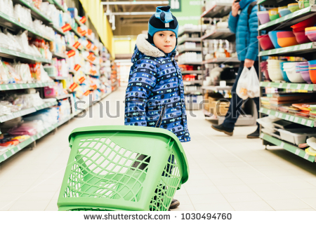stock photo little child boy holding shopping basket in supermarket store