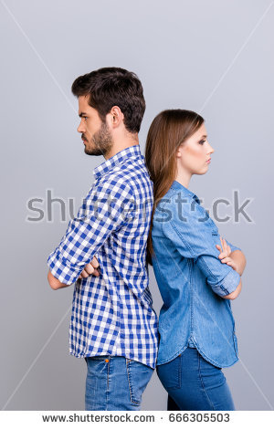 stock photo mistrust and cheat problems annoyed couple is ignoring each other standing back to back wearing