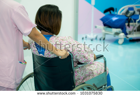 stock photo nurse transfer pregnant woman wheelchair to labor room nurse pushing wheelchair with female