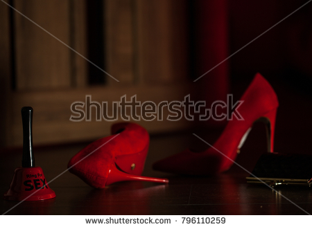 stock photo red ring for sex lying on wooden floor near red woman wonderful pair of heels and near nighttie