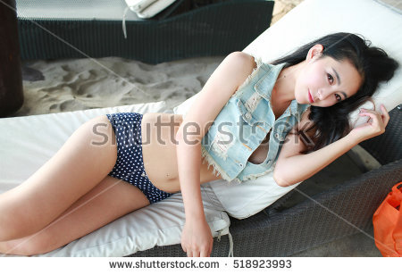 stock photo sexy beautiful asian japanese model young lady pin up girl posing lying on lounge chair wearing