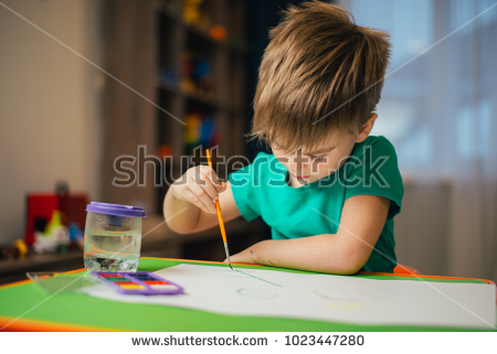 stock photo small child painting with watercolors close up of baby holding brush and painting on white paper