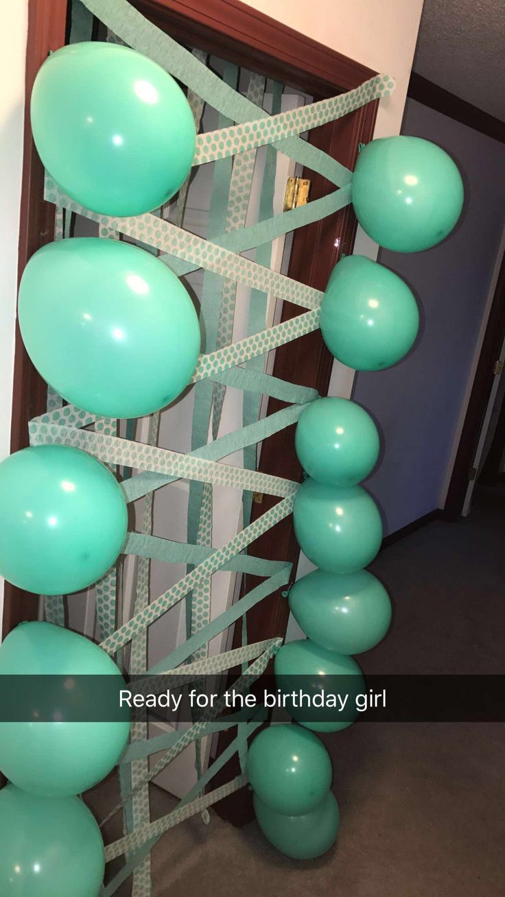 surprise for the birthday girl door full of balloons and streamers birthday decor