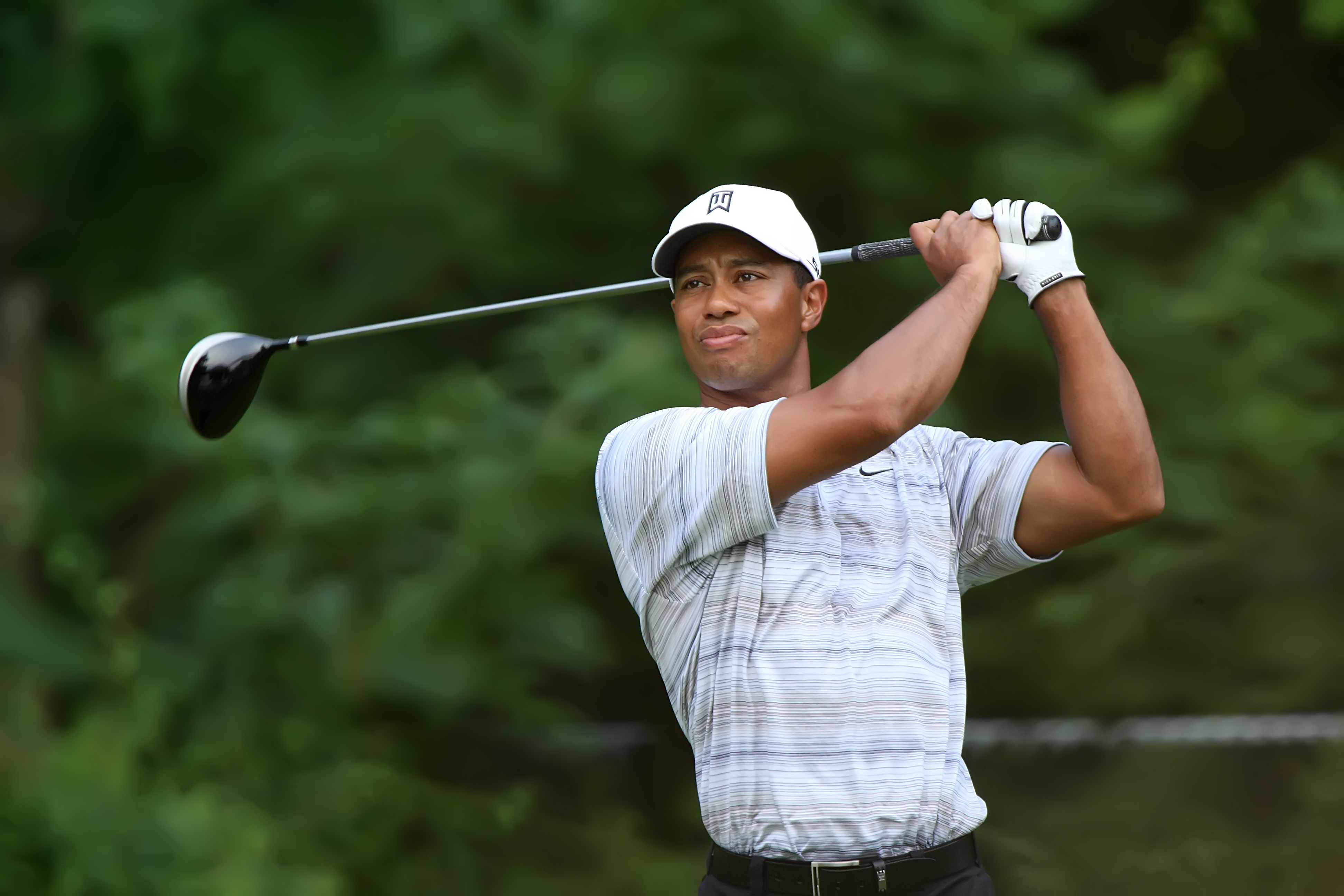 tiger woods an african american male in his early looks serious