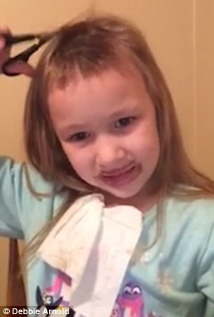 video shows young girl attempting to cut her own hair 1