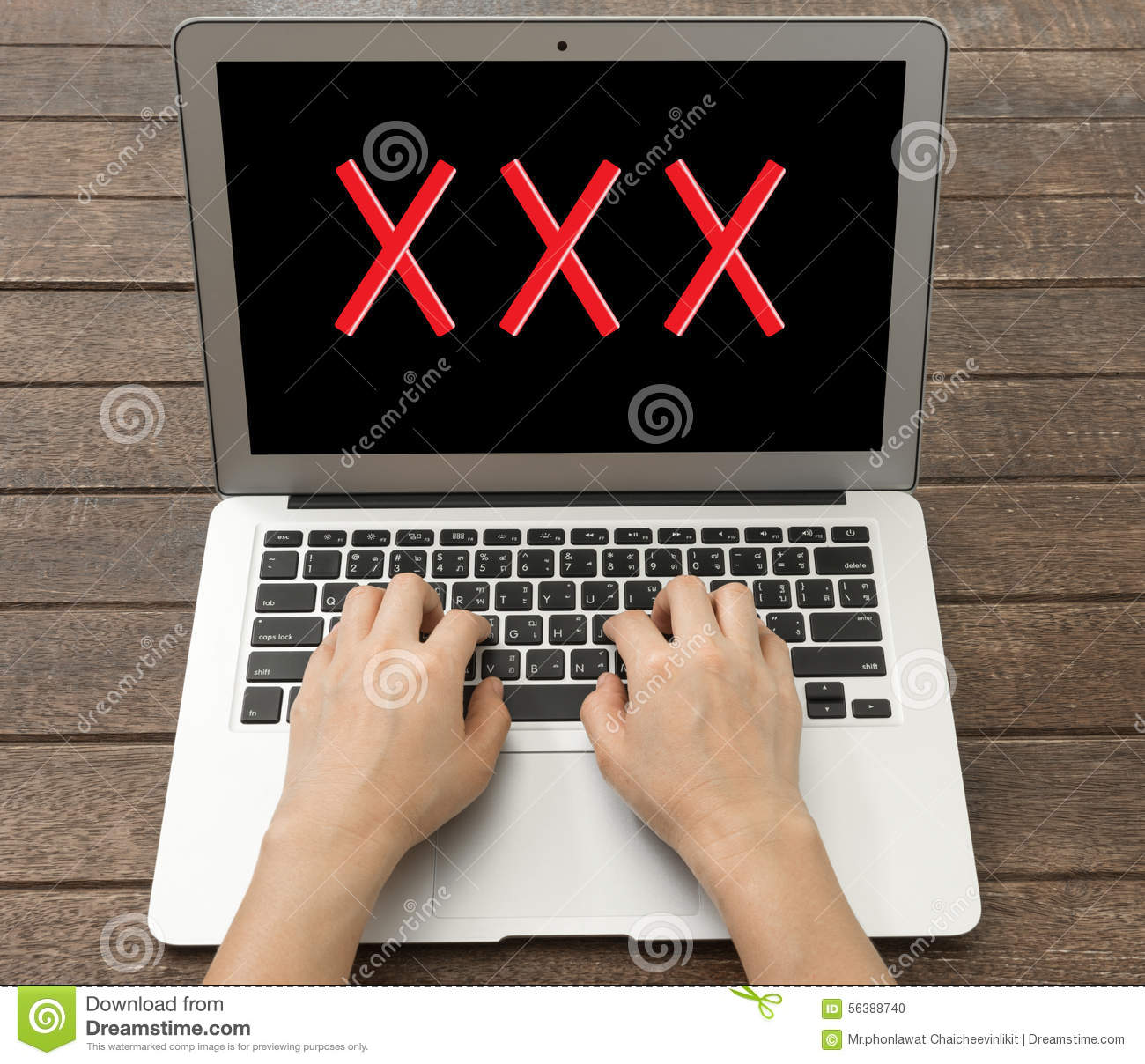 xxx sexual written on laptop monitor on wooden background porn concept stock photo