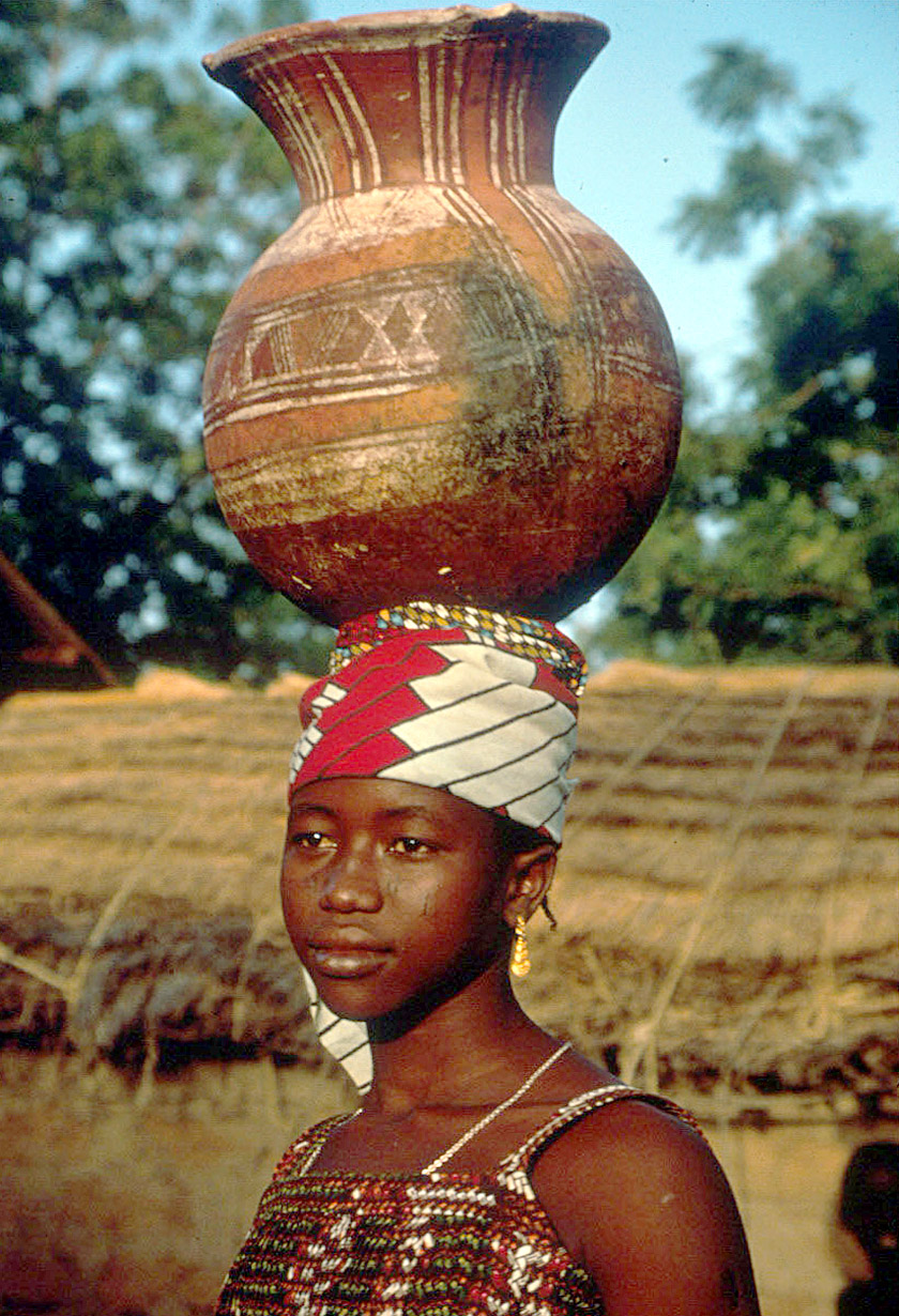 zarma woman carrying decorated water pot on head near niamey niger photograph eliot elisofon